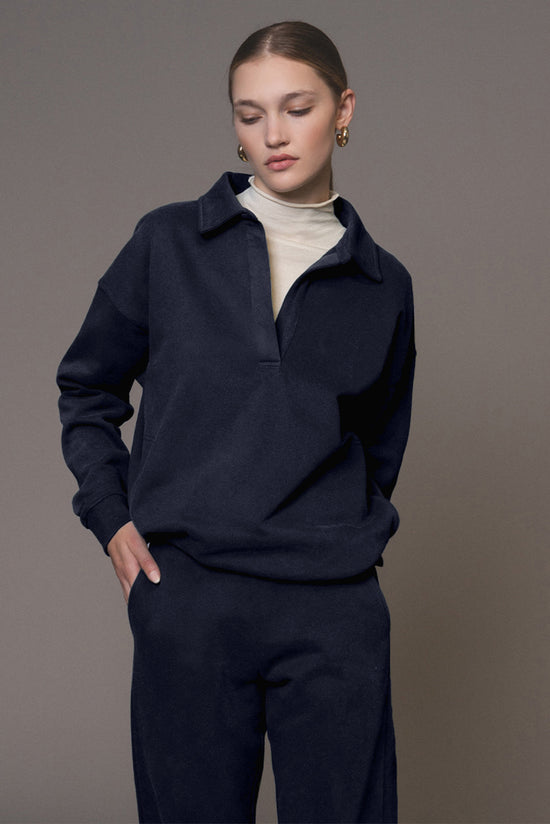 Swears and navy blue jogging sweater and pants in folded collar