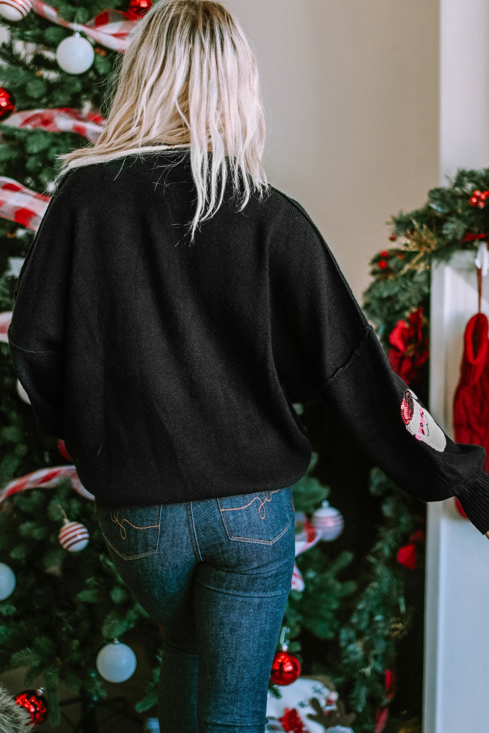 Black sequined sweater with Santa bishop sleeves