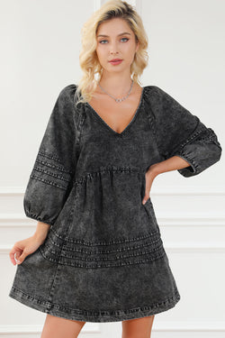 Black pleated denim babydoll dress with v-neck and puff sleeves