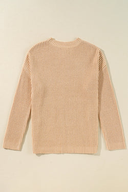 Ample knitted apricot knit sweater with drooping shoulders and side slits