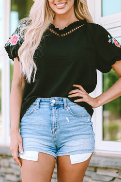 Black high with V -neck and puffy sleeves embroidered with flowers