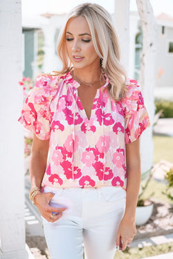 Pink flower high with split neck and puffy sleeves with ruffles