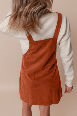 Sleeveless velvet overall dress with pockets before cinnamon units