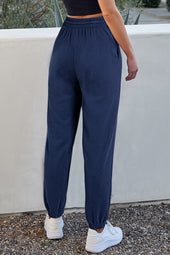 Navy blue drawstring waist jogging pants with solid color fleece lining