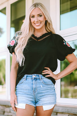 Black high with V -neck and puffy sleeves embroidered with flowers