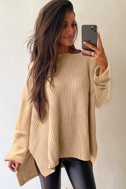 Ample knitted apricot knit sweater with drooping shoulders and side slits