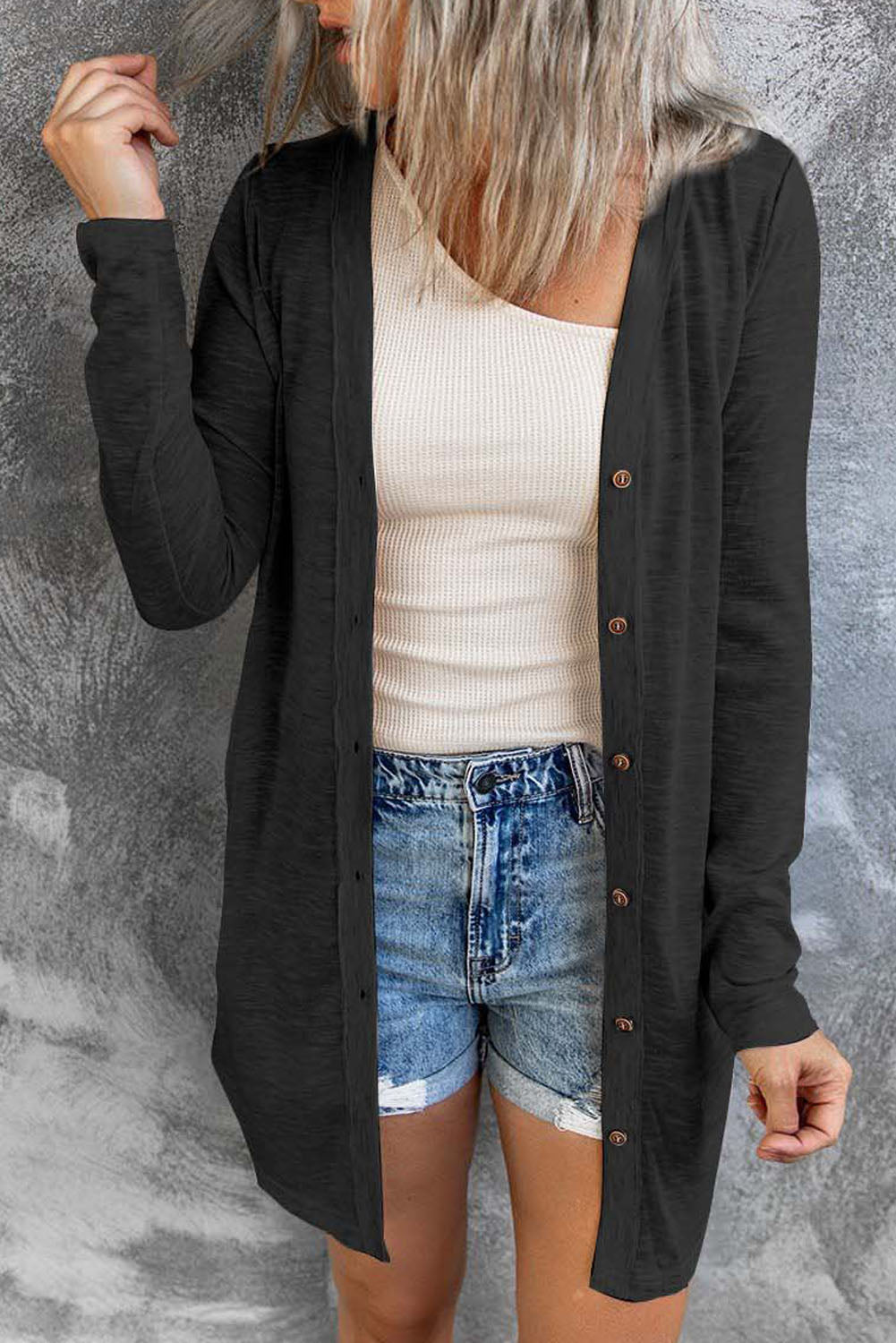 Black open button cardigan in solid color