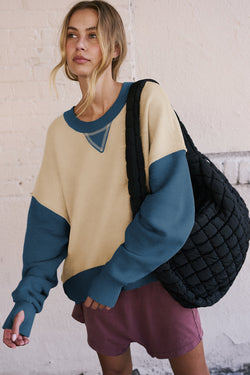 Drooping and sleeve shoulder sweatshirt with hole for the thumb