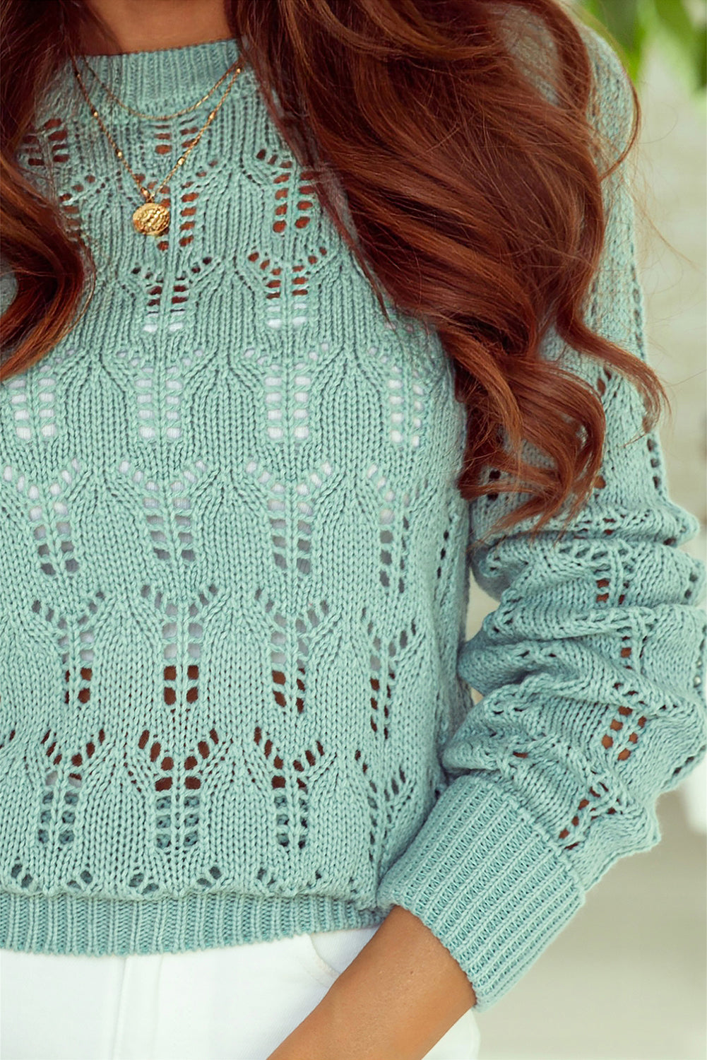 Green sweater in transparent pointelle knit