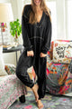 Black baggy jumpsuit with v-neck and flat seam details