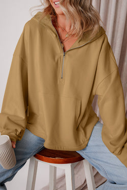 Brown loose hoodie with kangaroo pockets and half-zip lined with fleece