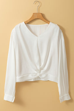 Short white blouse in V -neck and twisted elastic hem