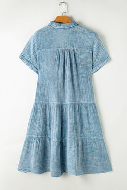 Dress on several levels crumpled with split neckline and raw hem beautiful blue