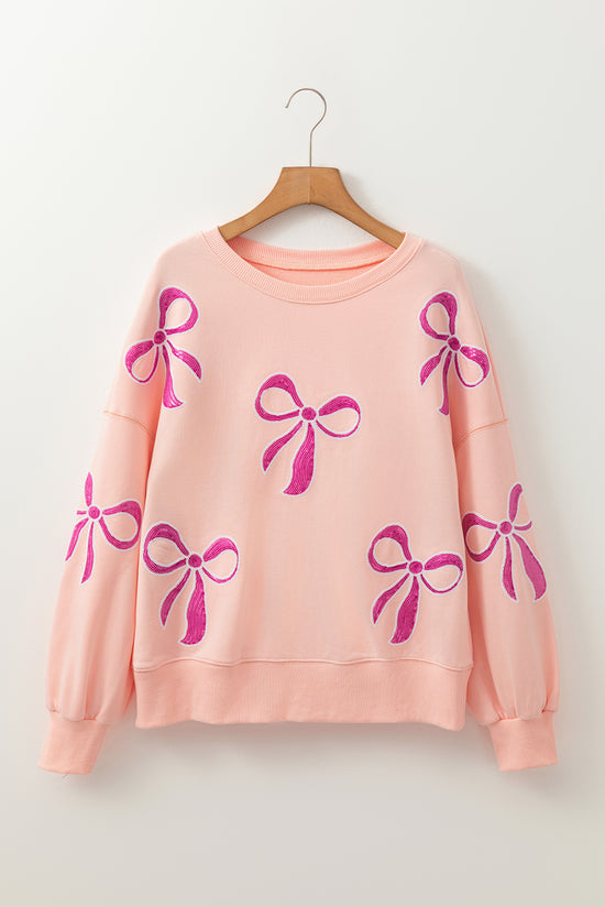 Sudadera de albaricoque rosa de gran tamaño con brillo y nudo de mariposa caída