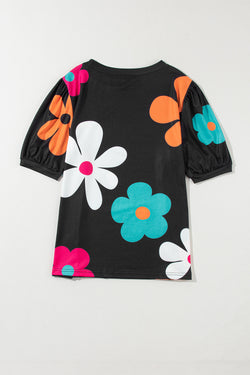 Camiseta negra con burbujas y estampados florales *