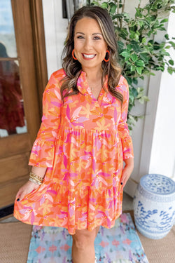 Orange dress with abstract print and ruffled sleeves, V-neck