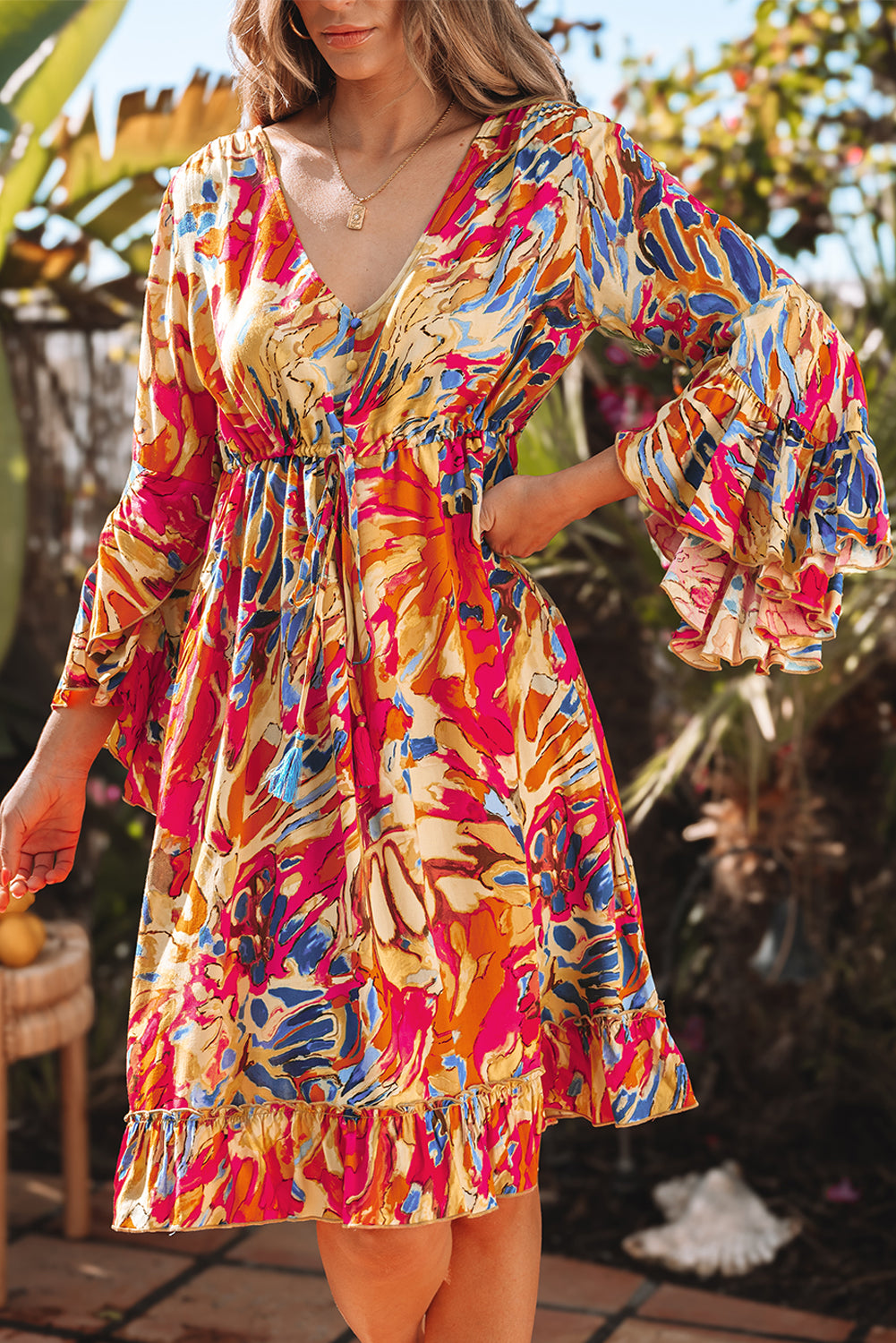 Pink fluid dress with flared sleeves *