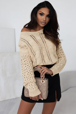 Khaki sweater with twisted knitted knitting with drooping shoulders