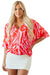 Oversize red blouse with abstract print, V-neck, bat handles