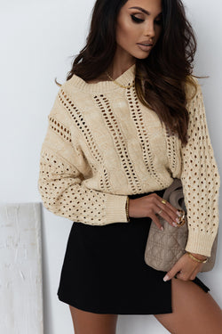 Khaki sweater with twisted knitted knitting with drooping shoulders