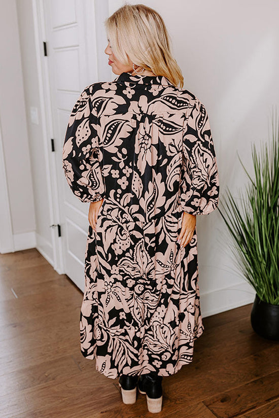 Long black dress with floral print and large puffing sleeves