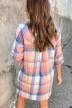 Pink plaid shirt dress with rolled up sleeves and side slit