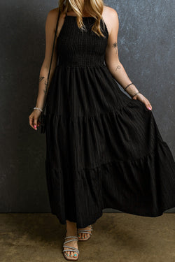 Black long dress with ruffles and spaghetti straps, smocked and pleated