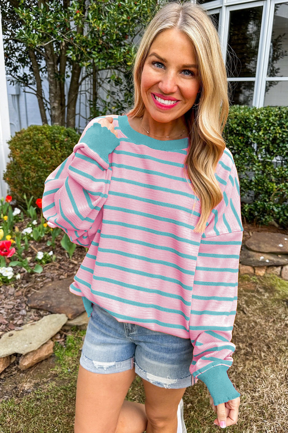 Loose sweater with pink stripes and round neck, dropped shoulders