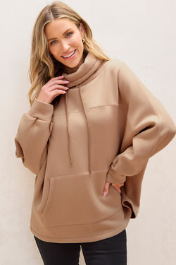 Light beige turtleneck sweatshirt with dolman sleeves and drawstring