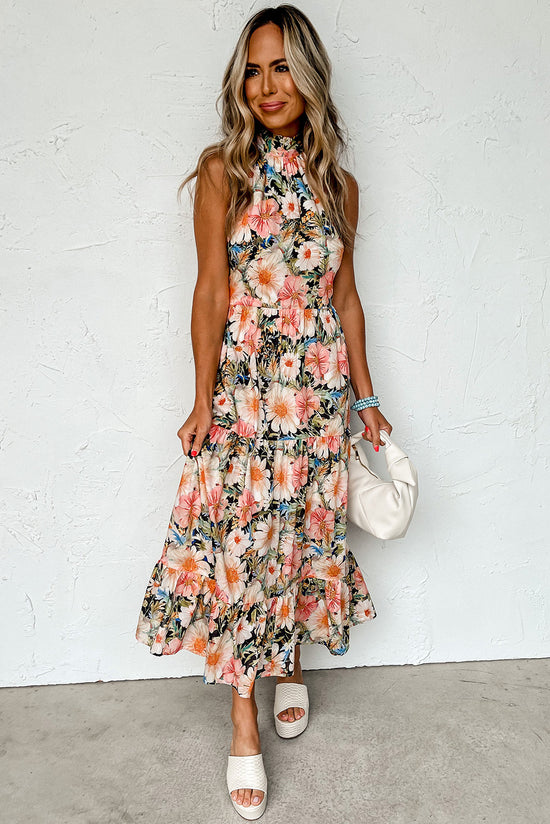 Long black dress with ruffles and Licou collar knotted with bohemian floral print