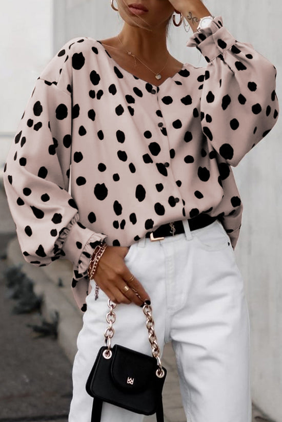 Surprised pink blouse with puffy sleeves and ruffle cuffs