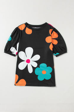 Camiseta negra con burbujas y estampados florales *