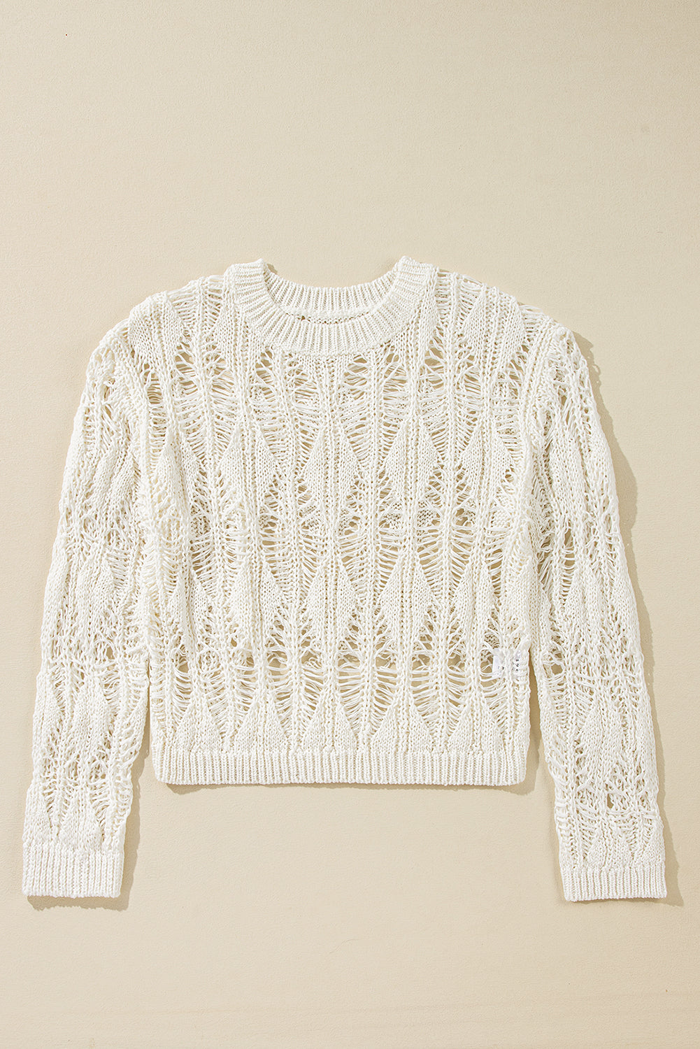 White crew neck loose sweater with crochet cutouts