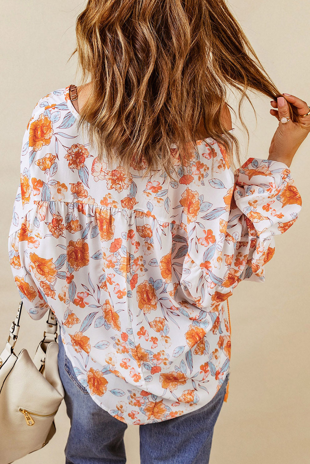 Blouse Dolman orange fendue à col en V et imprimé floral