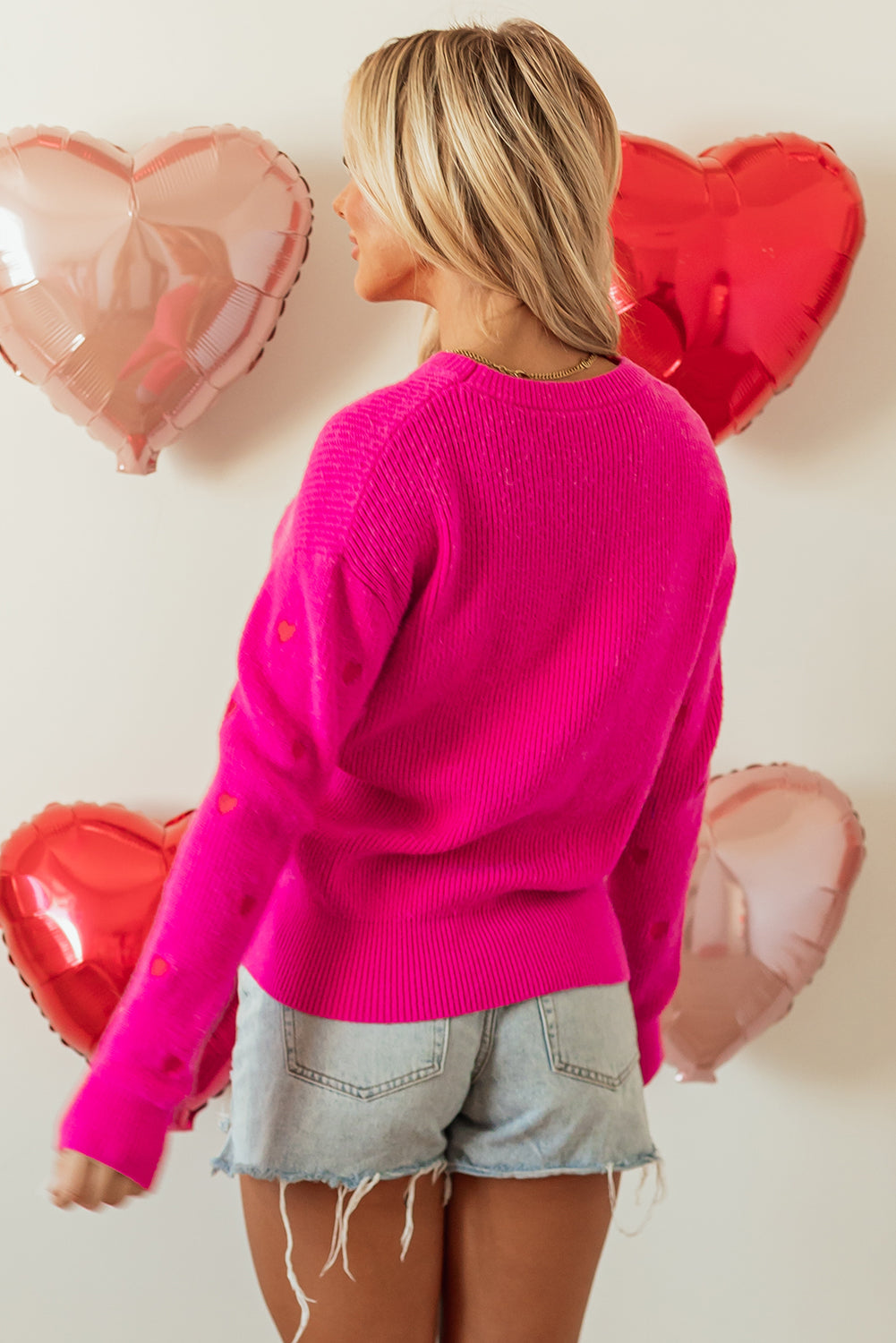 Pull à col rond et épaules tombantes en forme de cœur rose rouge