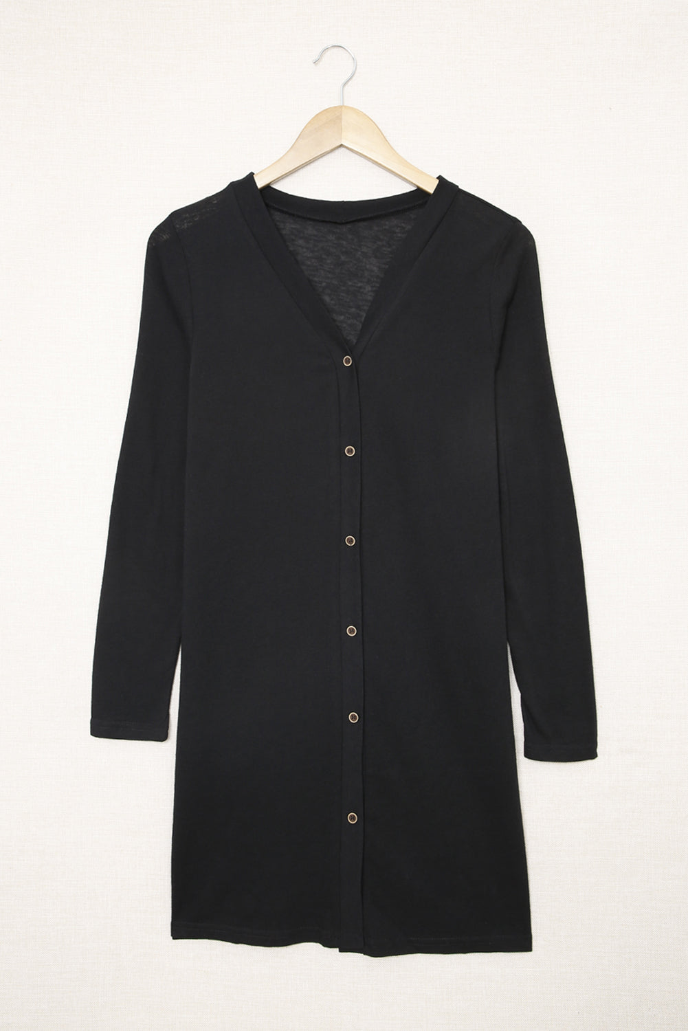 Black open button cardigan in solid color