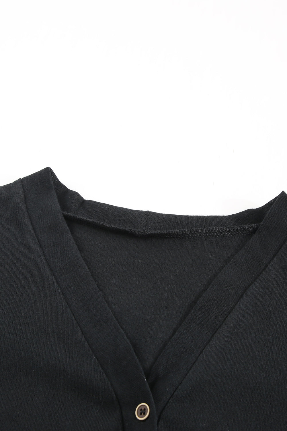 Black open button cardigan in solid color