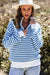 Sky blue striped sweater with zipped collar and dropped shoulders