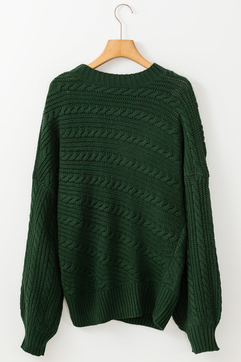 Pull en tricot torsadé à manches lanternes et col montant vert noirâtre