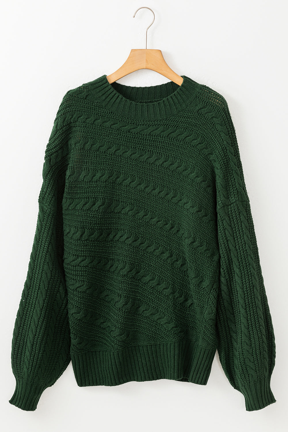 Pull en tricot torsadé à manches lanternes et col montant vert noirâtre