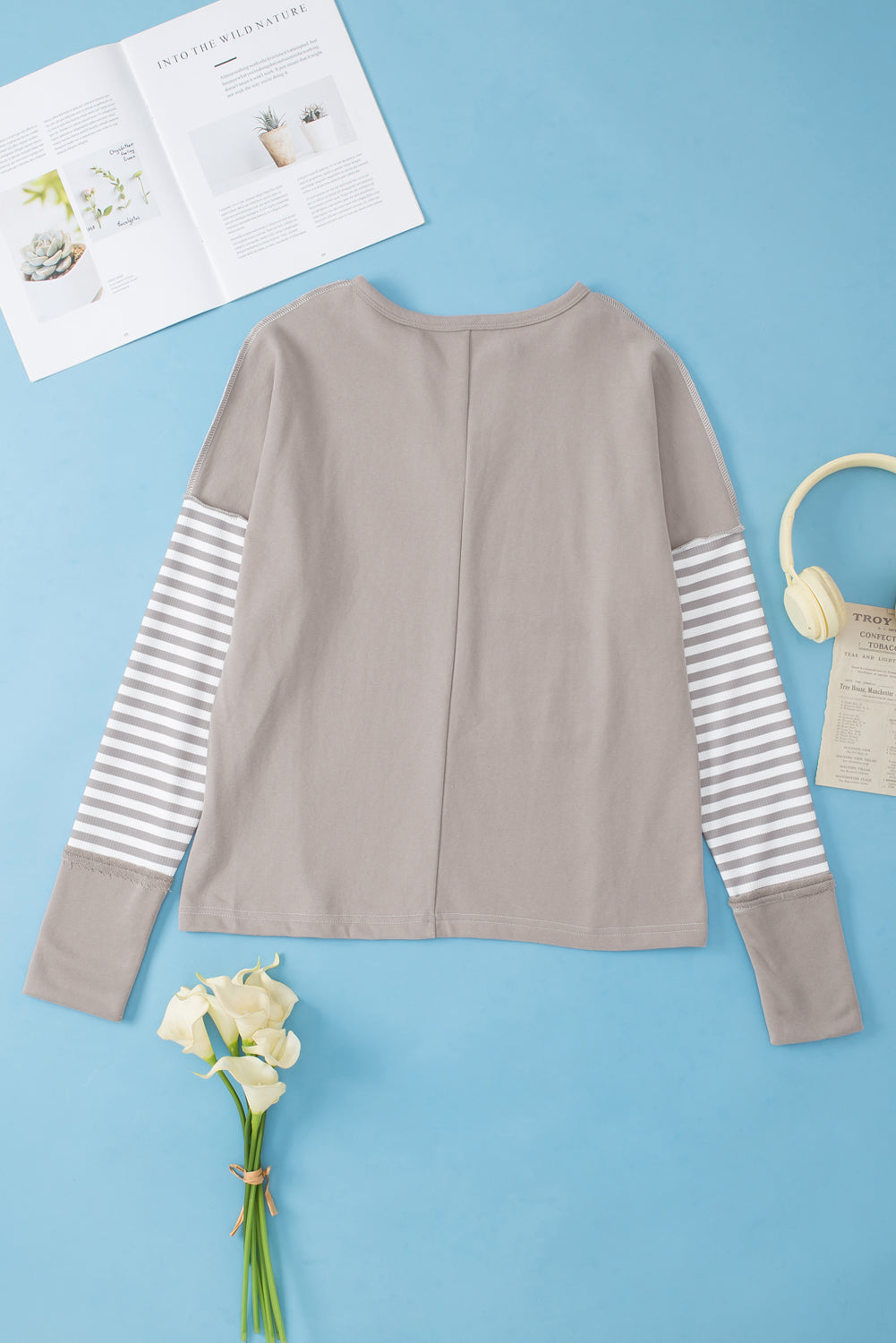 White top with sleeves with thumbhole and leopard striped patch