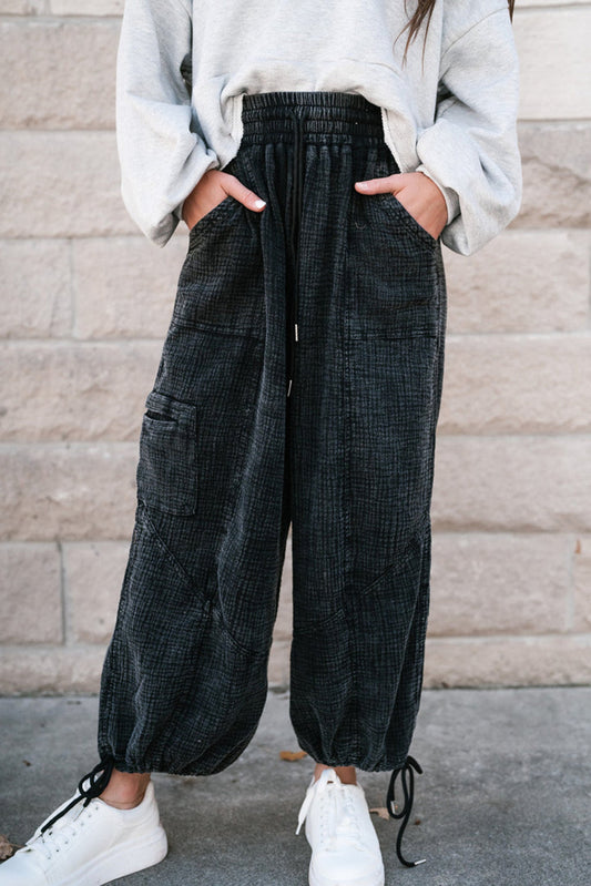 Black textured mineral wash wide leg pants with drawstring