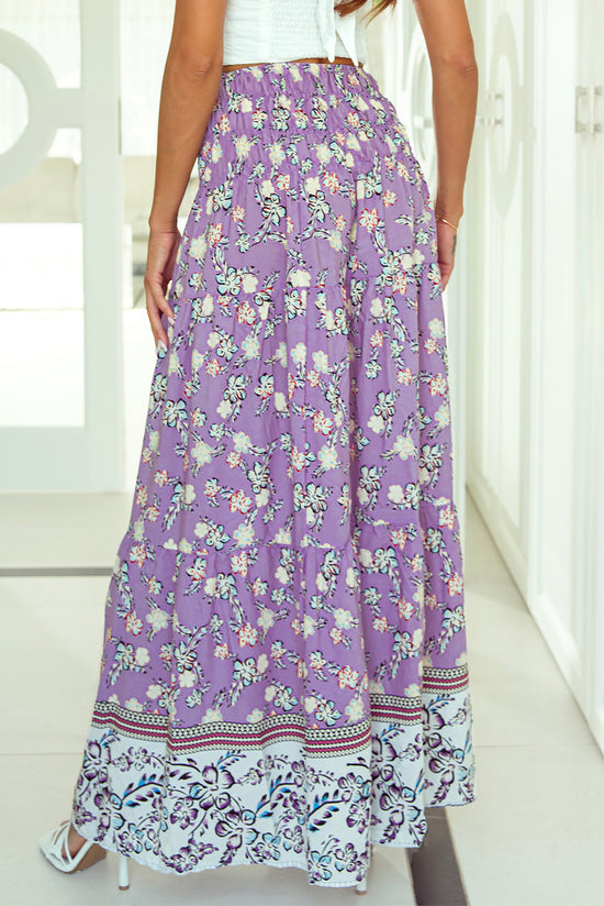 Long -sized long -waisted skirt with purple floral print