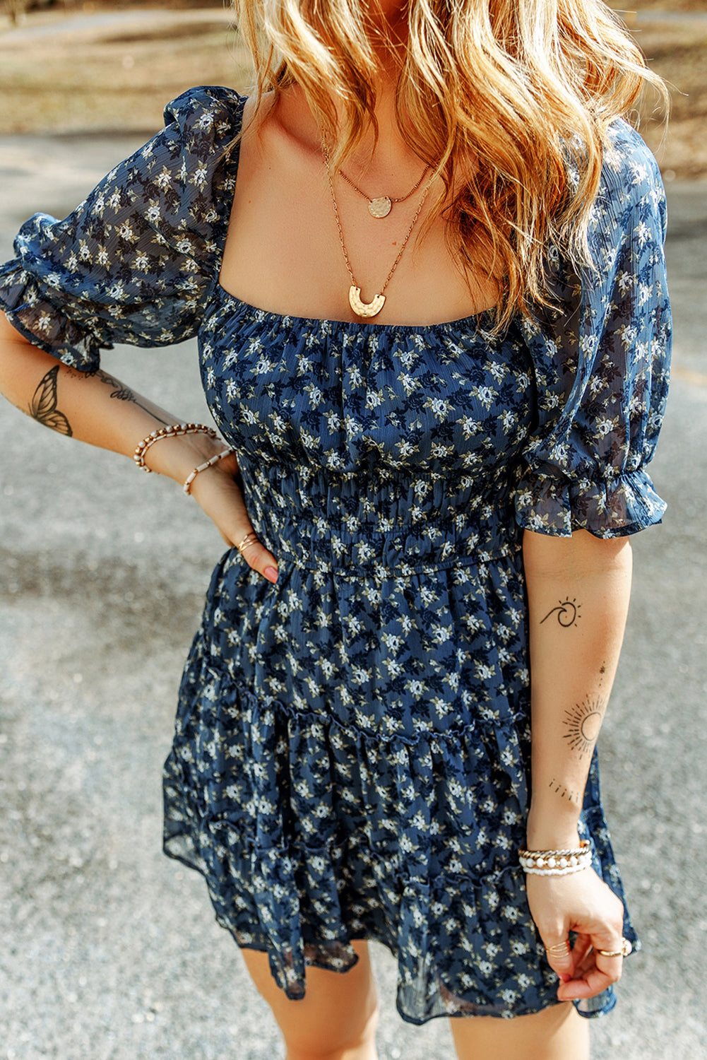 Short dress with ruffles and floral smocking in voile blue