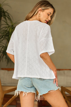 Fluid white knitted blouse with v -neck collar