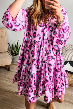 Bouton dress on the front with pink leopard print, 3/4 sleeves and ruffle hem