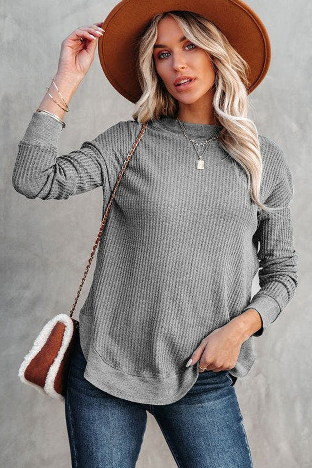 Grey waffle knit top with ribbed trim and crew neck