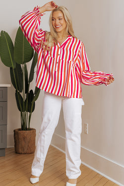 Orange striped blouse, balloon sleeves, notched v collar, buttoned on the front