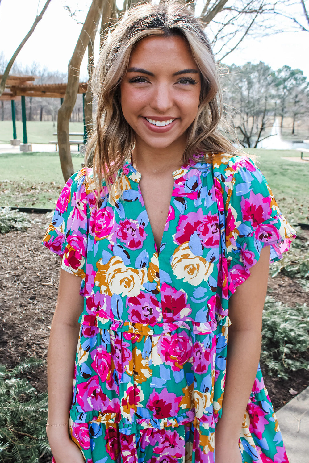 Short dress with ruffles and pink green floral print