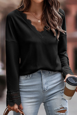 Black long sleeve v-neck top with lace trim and ribbed texture